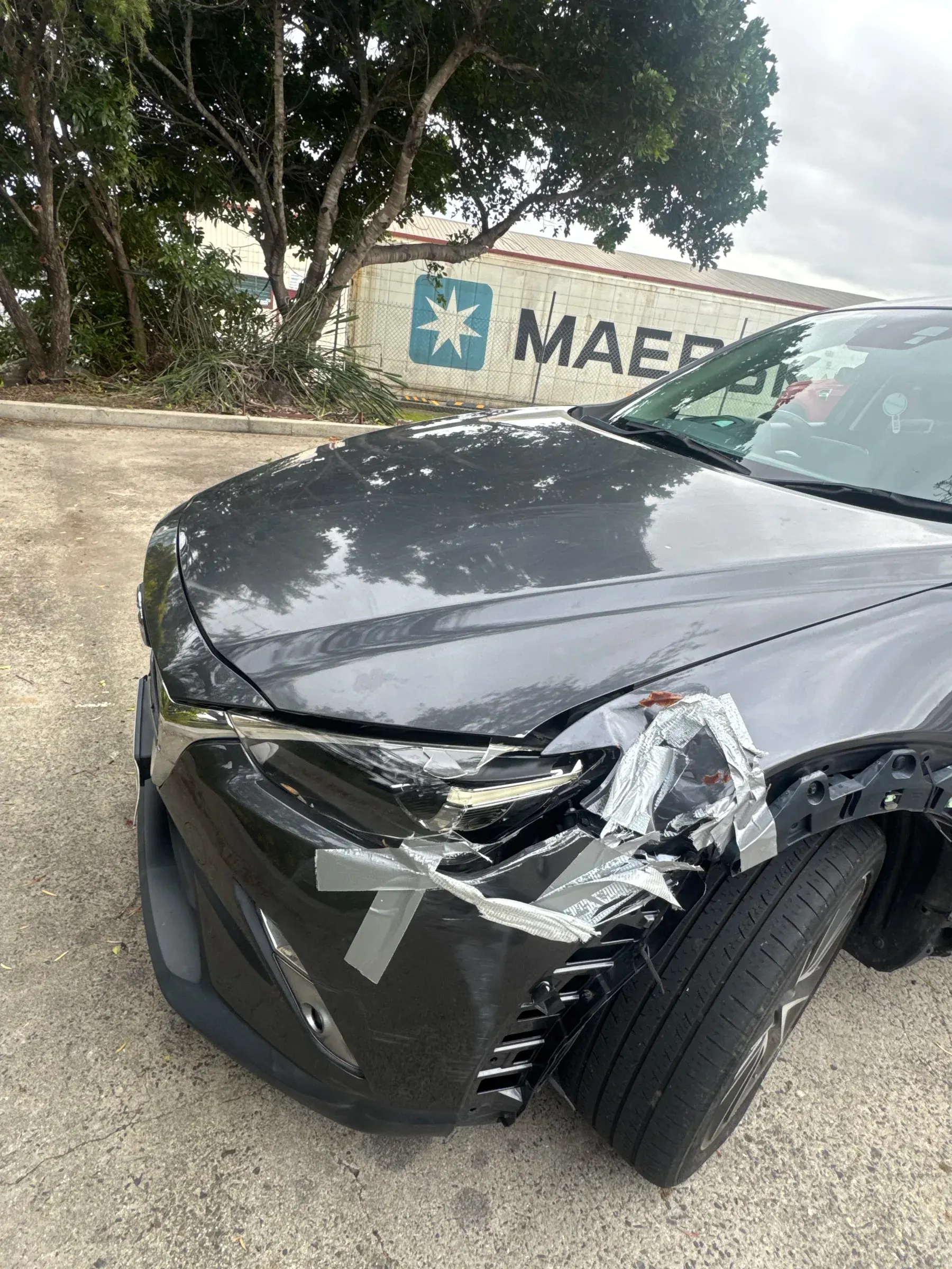 Sedan with heavy front-end crash damage collected for cash
